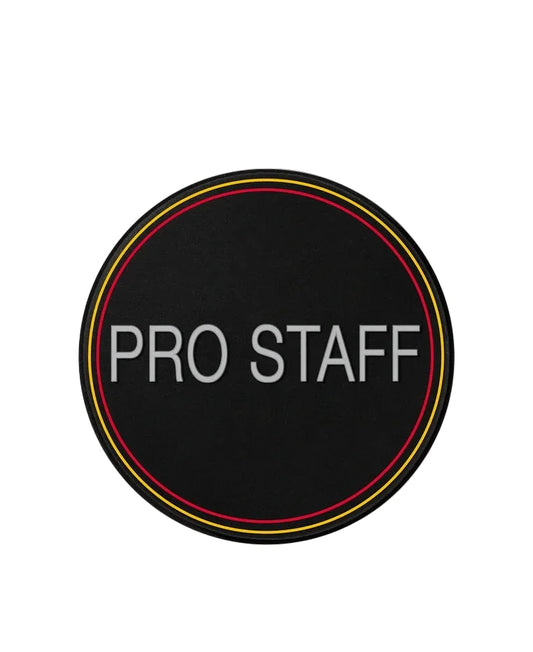 Round black sticker with 'PRO STAFF' text on a white background